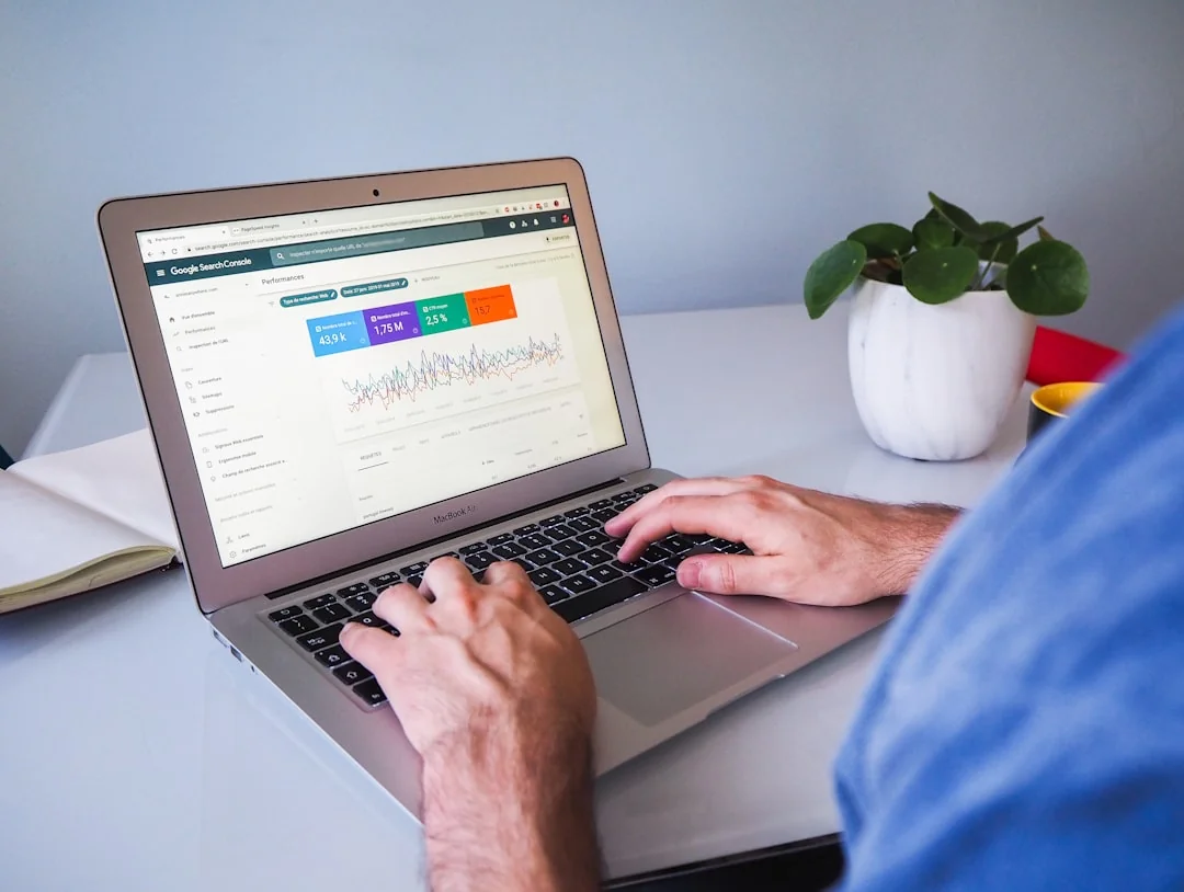 services-01 Individual reviewing cryptocurrency data on a laptop, emphasizing financial insights.